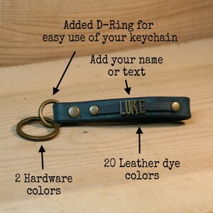 May include: A blue leather keychain with a brass D-ring and two brass rivets. The keychain has a brass plate with the name "LUKE" engraved on it. The keychain is available in 20 leather dye colors and 2 hardware colors.