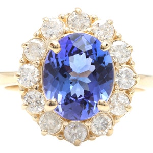 4.15 Carats Natural Very Nice Looking Tanzanite and Diamond 14K Solid Yellow Gold Ring