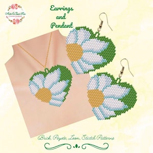 May include: A beaded jewelry set featuring a heart-shaped pendant and matching earrings. The design includes a white flower with blue accents and a yellow center, framed by green beads. The text "Earrings and Pendant" is visible.