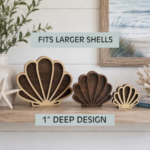 May include: Three dark brown wooden shell-shaped display stands in descending sizes, each featuring a 1-inch deep design. The text FITS LARGER SHELLS and 1" DEEP DESIGN is visible. These decorative items have a scalloped edge and a smooth finish.