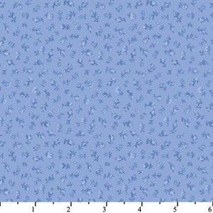 May include: A light blue fabric with a repeating pattern of small white flowers and leaves.
