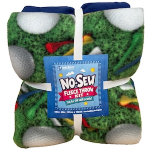 May include: A bundled fleece throw kit with a golf course design. The green fleece features white golf balls, colorful flags, and grass. The kit includes a blue tag that reads "NO-SEW FLEECE THROW KIT". The throw measures 50in x 60in.