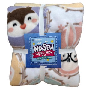 May include: A bundled no-sew fleece throw kit featuring owl designs in purple, pink, and white. The kit includes a blue tag with the text "NO-SEW FLEECE THROW KIT" and measures 50 inches by 60 inches.