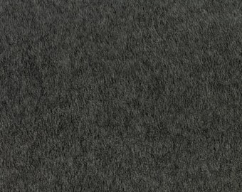May include: A close-up of a dark gray, textured fabric. The fabric has a soft, fuzzy appearance.
