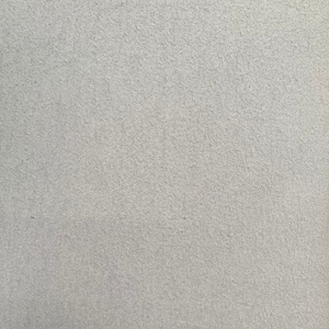 May include: A close-up of a light gray textured fabric surface.
