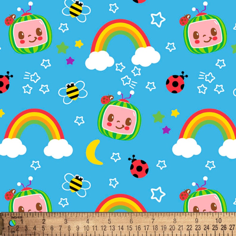 May include: A blue fabric with a repeating pattern of cartoon characters, rainbows, stars, ladybugs, and bees. The cartoon characters are green and red and resemble televisions with smiling faces. The rainbows are yellow, orange, and red. The stars are white. The ladybugs are red with black spots. The bees are yellow and black.