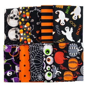 May include: A set of 12 Halloween-themed fabric squares featuring various designs, including skulls, candy corn, eyeballs, pumpkins, ghosts, and spiders. The fabric squares are black, orange, and white.