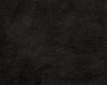 May include: A close-up of a black textured surface.