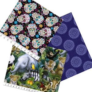 May include: An assortment of fabric swatches featuring various patterns. One swatch displays colorful sugar skulls on a black background. Another showcases a jungle scene with animals. The third has a blue mandala design.
