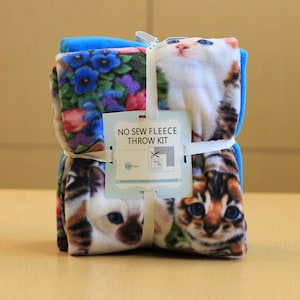 May include: A no-sew fleece throw kit with a colorful cat print. The kit includes a cardboard template and instructions for making a throw blanket. The kit is suitable for ages 12 and up.