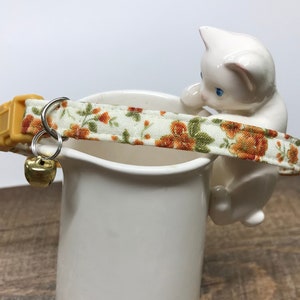 Paprika Orange Flowers on cream cat collar with safety breakaway buckle and gold bell ~ ginger cat, gold accents with moss green leaves