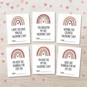 Könnte beinhalten: Sechs Valentinstagskarten mit Regenbogenillustrationen in Rot-, Türkis- und Brauntönen. Jede Karte enthält eine andere Botschaft, wie z. B. „Ich hoffe, Sie haben einen magischen Valentinstag!“ und „Du verschönerst meinen Tag, Valentinstag!“