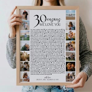 May include: A framed print with the text "30 Reasons We Love You" and several small photos. The print has a light wood frame and includes a list of reasons. The names "Susan, Joe, Allison & Amy" are at the bottom.