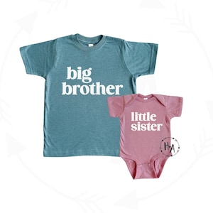 big brother little sister matching shirts. blue big brother shirt and mauve pink little sister bodysuit with matching font.