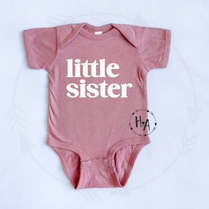 mauve pink little sister baby one-piece bodysuit. for new little sister gender reveal.