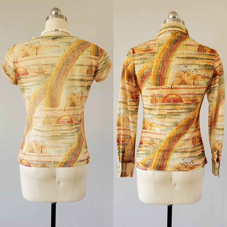 May include: A short-sleeved and a long-sleeved shirt with a colorful abstract print featuring a sunset, palm trees, and a rainbow. The shirt is made of a lightweight fabric and has a button-up collar.