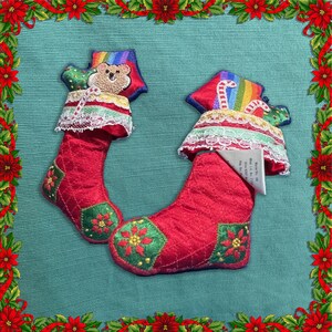 Hallmark Keepsakes Ornament: Vintage 1983 Embroidered Stocking set of two. Adorable, embroidered poinsettia patches on the heal and toe.