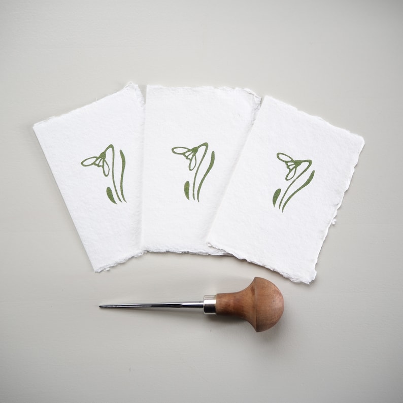 A set of three Lino Printed Snowdrop Gift Cards.