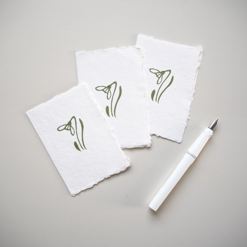 A set of three Lino Printed Snowdrop Gift Cards.