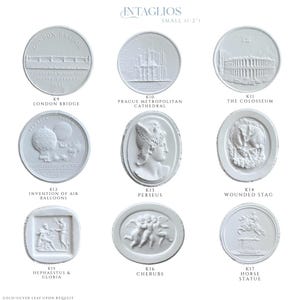 May include: A collection of small, white intaglio plaques, each featuring a different classical design. Designs include the London Bridge, Prague Metropolitan Cathedral, the Colosseum, and cherubs. The text "INTAGLIOS SMALL (1-2")" is at the top.