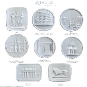 May include: A collection of white plaster intaglios, each featuring a different classical architectural design or relief. The intaglios are in various shapes, including round and rectangular, and depict landmarks such as the Colosseum and the Temple on the Janiculum.