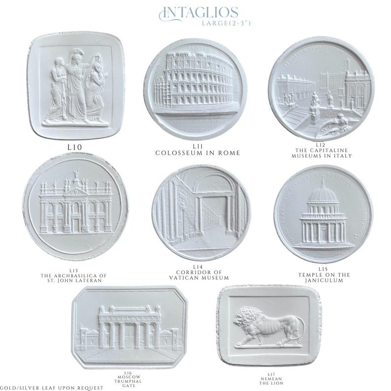 May include: A collection of white plaster intaglios, each featuring a different classical architectural design or relief. The intaglios are in various shapes, including round and rectangular, and depict landmarks such as the Colosseum and the Temple on the Janiculum.