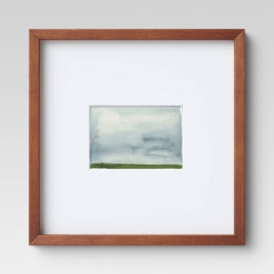 May include: A framed watercolour painting of a cloudy sky with a green field in the foreground.