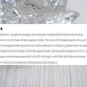 May include: A close-up of a clear, faceted crystal object with a review of a beaded eyeglass chain. The review text mentions a 24-inch chain and a 28-inch chain. The text also mentions the item purchased: Sparkling Silver Eyeglass Chain, Beaded Eyeglass Holder.