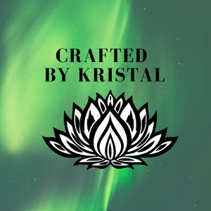May include: A graphic with the text "CRAFTED BY KRISTAL" in black, above a black and white lotus flower design, set against a green and teal background with a blurred aurora borealis effect.