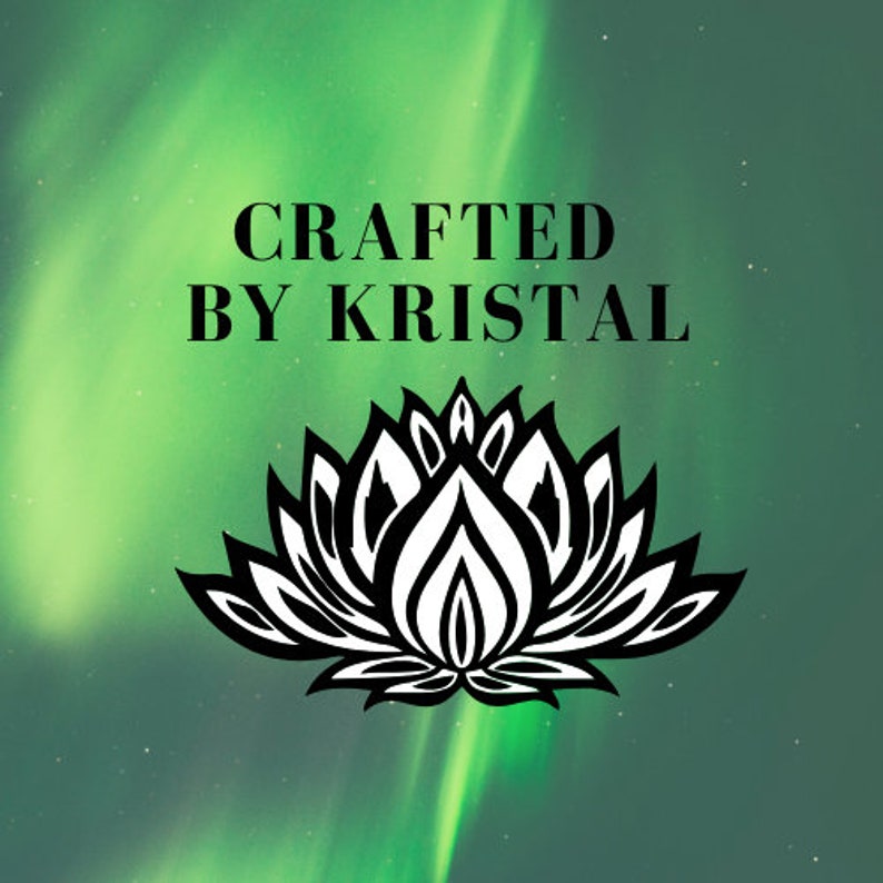 May include: A graphic with the text "CRAFTED BY KRISTAL" in black, above a black and white lotus flower design, set against a green and teal background with a blurred aurora borealis effect.
