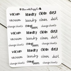May include: A white sticker sheet with black text. The words "vacuum", "laundry", "clean", "dust", and "change sheets" are repeated multiple times. The text is in a handwritten style. The sticker sheet has the text "Plan with Peggy Co."