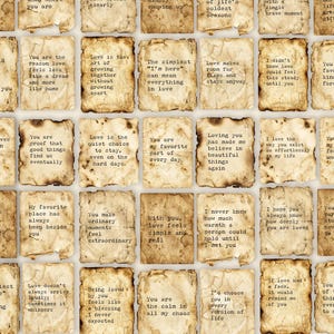 May include: A grid of rectangular paper scraps with burnt, uneven edges, each featuring a unique romantic quote printed in a typewriter-style font. The paper has a distressed, aged, tan, and brown parchment appearance with visible stains.