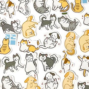 May include: A set of colorful stickers featuring various cartoon cats and dogs in different poses. The stickers are perfect for adding a touch of whimsy to journals, laptops, water bottles, and other surfaces.