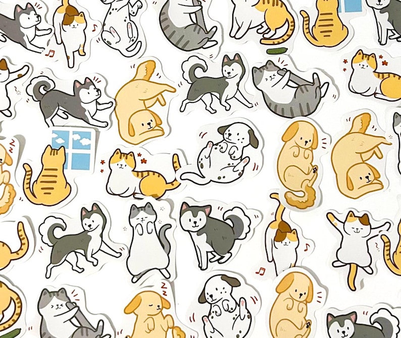May include: A set of colorful stickers featuring various cartoon cats and dogs in different poses. The stickers are perfect for adding a touch of whimsy to journals, laptops, water bottles, and other surfaces.