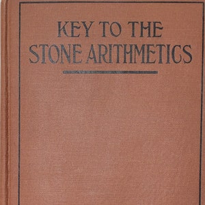May include: A brown book with the title "KEY TO THE STONE ARITHMETICS" printed in black on the front cover.