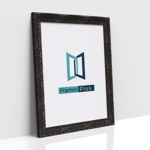 May include: A black wood picture frame with a distressed finish. The frame has a white mount and a white background with a blue and teal logo that says "Frames Plus".
