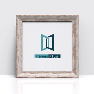 May include: A white picture frame with a distressed wood finish. The frame has a simple design with a thin border. The frame is displaying a logo for Frames Plus, which features a stylized image of two doors opening.