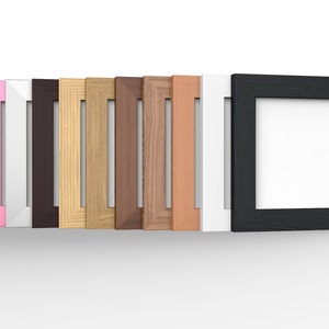 May include: A row of 10 picture frames in various colours and wood finishes. The frames are all the same size and shape, and they are arranged in a line from left to right. The frames are all empty, and they are ready to be used to display photos or artwork.