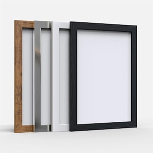 May include: Four picture frames in different colours and styles. The frames are arranged from left to right: brown wood, silver metal, white, and black.