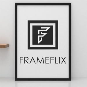 May include: A framed print with a black border. The print features a black square with a white stylized letter "F" inside a white border. Below the square is the word "FRAMEFLIX" in a sans-serif font.