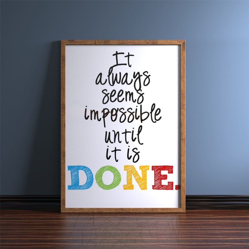 May include: A framed motivational quote on a white background. The quote reads "It always seems impossible until it is DONE." The word "DONE" is written in large, colorful letters.