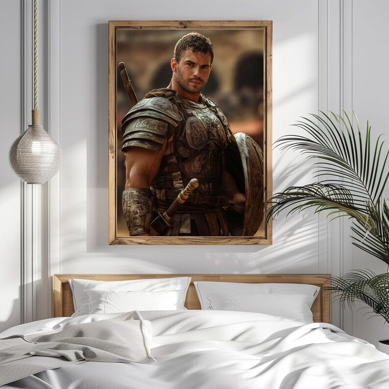 May include: A framed print featuring a muscular man in ancient Roman armor, including a breastplate, shoulder guards, and a shield. The artwork is set against a blurred background, with a wooden frame. The image is displayed above a bed with white linens.