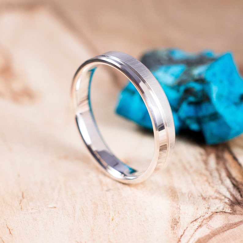 Polished and brushed silver ring. Engagement ring, wedding ring. Polished and brushed silver ring. Engagement ring, wedding ring.