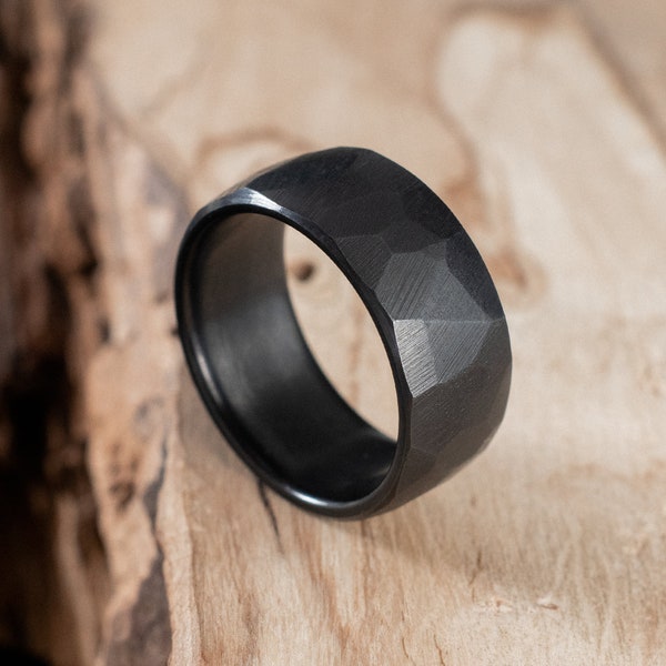 Pure fire-blackened titanium faceted ring. Engagement ring, wedding ring.