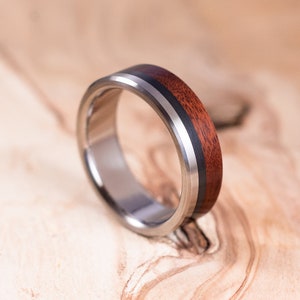 Titanium and carbon fiber ring, Mopane wood. Wedding ring, engagement ring. Men&#39;s alliance ring