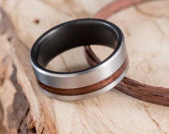 Fire-blackened titanium and Rosweood ring. Engagement ring, wedding ring.