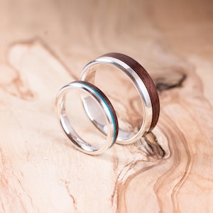 Pair of silver and rosewood wedding rings with chrysocolla inlay. Wedding ring, engagement ring.