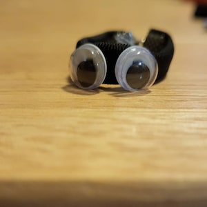 Googly eyed rings, black or orange
