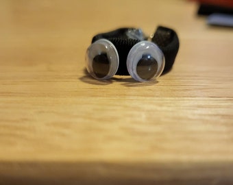 Googly eyed rings, black or orange