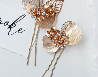 Aurora Hair Pins | gold floral wedding accessories featuring filagreed flowers and rhinestones